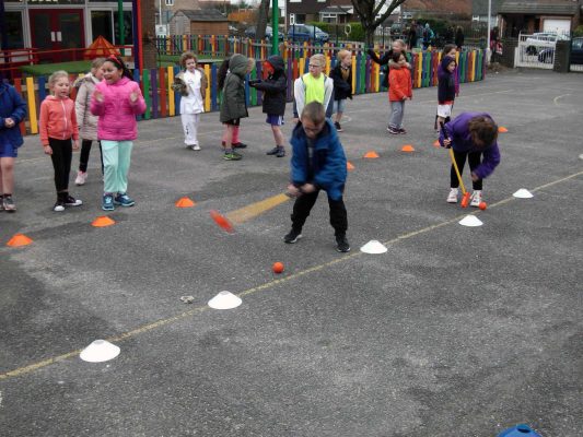 Image #7 of Kelly Bridges Golf Instructor running a Tri-Golf session for primary school children in the school playground.